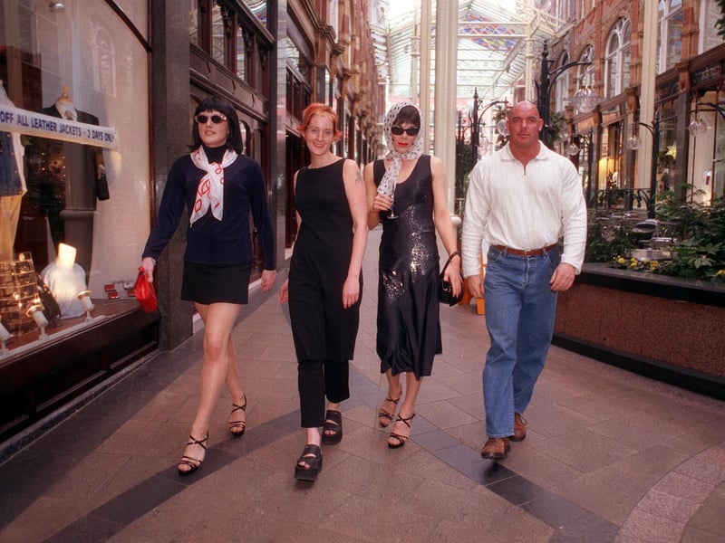 Photographer Casey Orr, pictured second from left, is joined by some of her subjects in a new collection of her work called 'Loiners' on show in the Victoria Quarter.