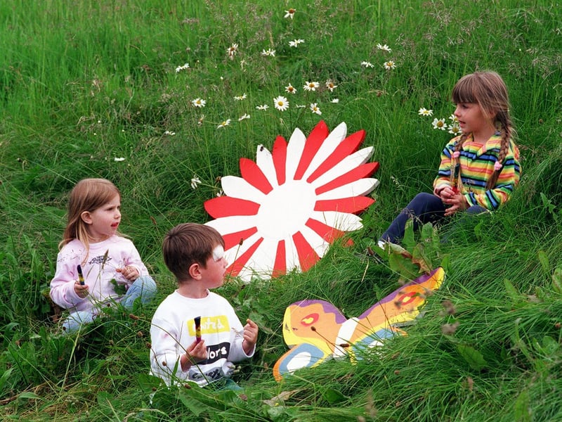 Children from the Strawberry Community Centre creche and playgroup helped Groundwork paint objects for a mural to brighten up their play area. Pictured, left to right, are Eva Schiffeldrin, George Carter and Ellis Smith.