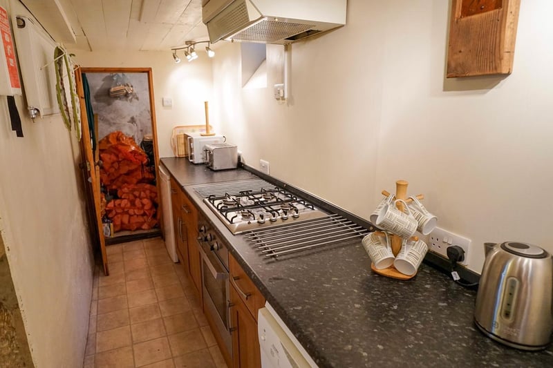 There are fitted units and an integral cooker within the kitchen