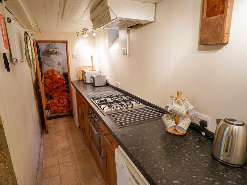There are fitted units and an integral cooker within the kitchen