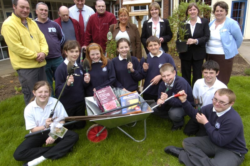 Staff and pupils at Eskdale School with volunteers who helped create their garden.