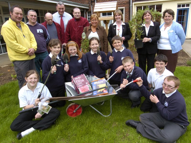 Staff and pupils at Eskdale School with volunteers who helped create their garden.