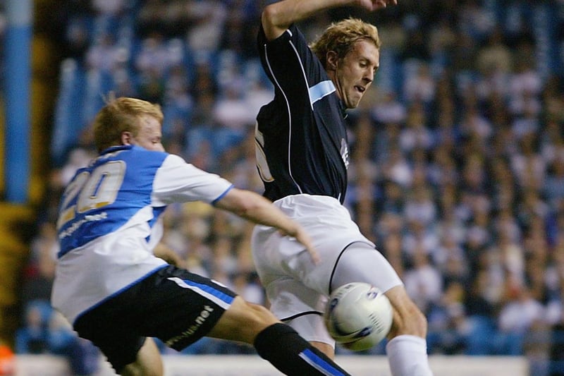 Rob Hulse challenges Sheffield Wednesday's Frank Simek during the  Championship clash at Hillsborough in September 2005.