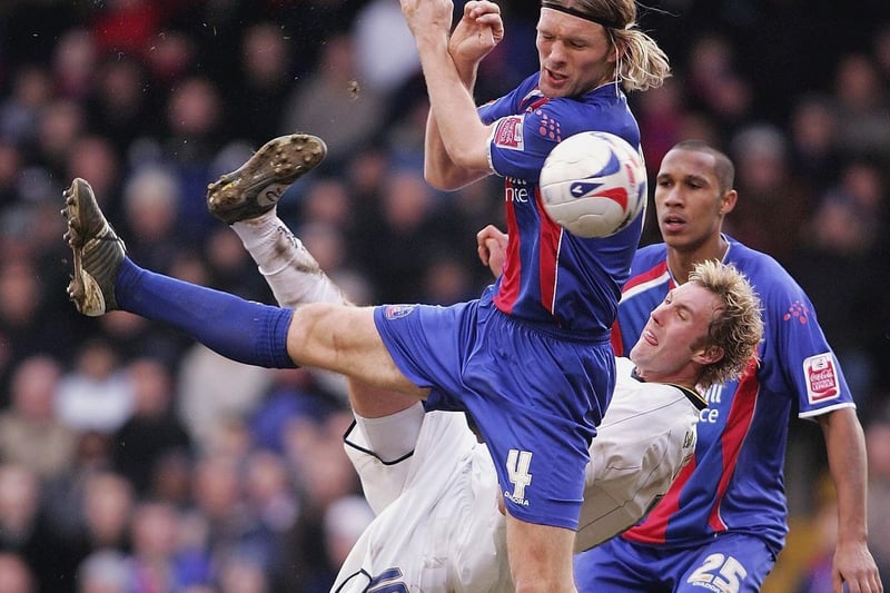 Rob Hulse fires an over head strike at goal as Crystal Palace's Darren Ward shields his face during the Championship clash at Selhurst Park in March 2006.