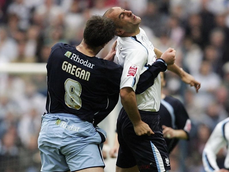 Sean Gregan and Preston North End striker Danny Dichio challenge for the ball.