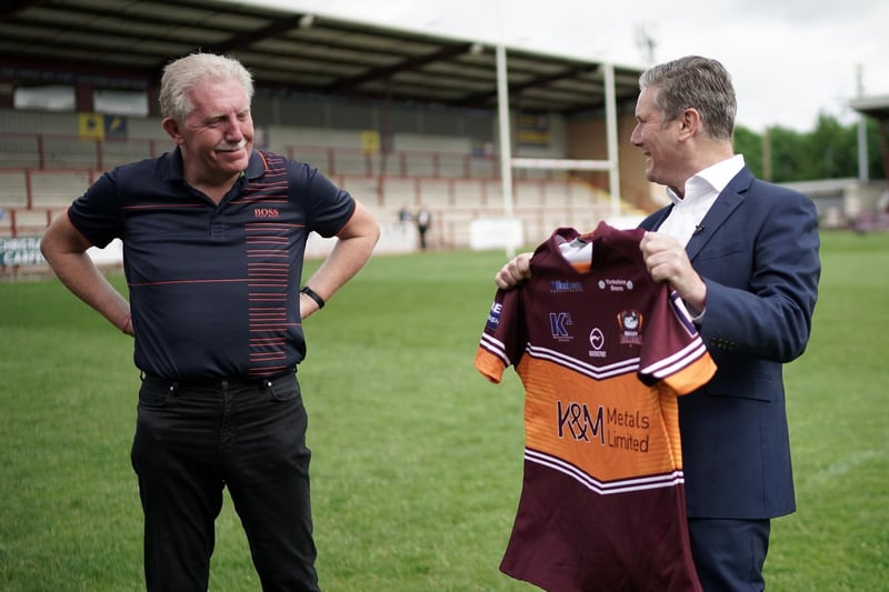 Labour party leader Sir Keir Starmer is presented with a club shirt by chairman Kevin Nicholas. Photo: Getty Images