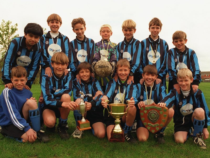Morley Cross Hall Junior School U-11s football team pictured with their trophies in May 1996.
