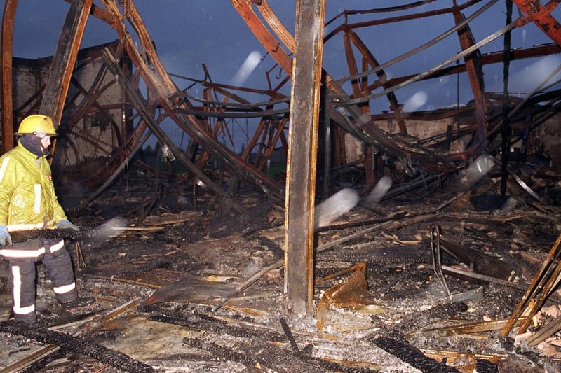 A fire officer surveys the damage done to Morley High in December 1996 after a fire tore through the school.