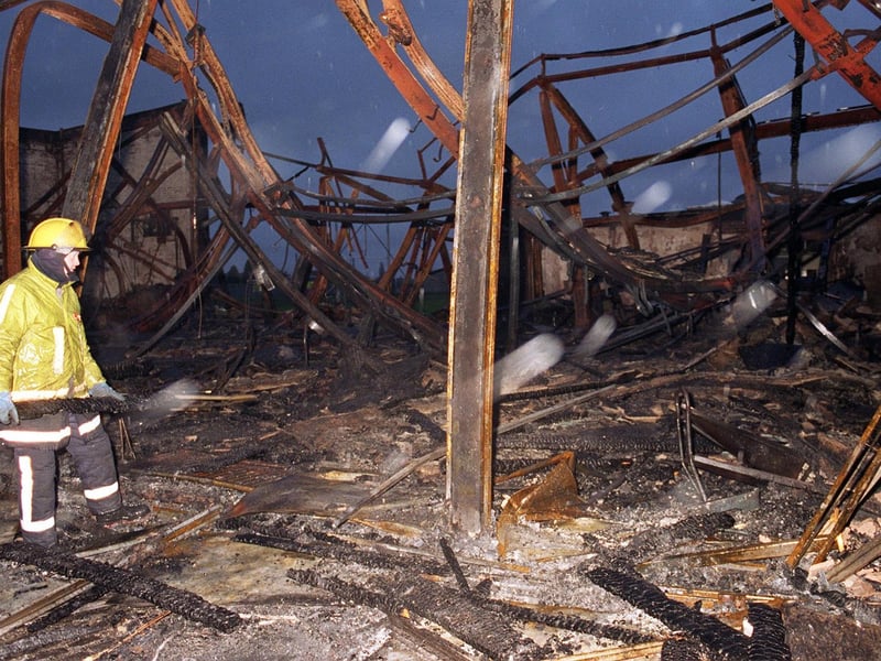 A fire officer surveys the damage done to Morley High in December 1996 after a fire tore through the school.