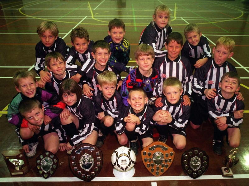 This is Churwell Lions U-9s football team who were celebrating success in November 1996.