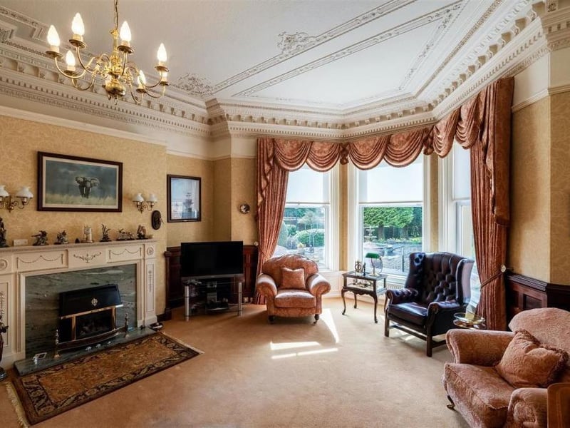 Also in this part of the property is the magnificent lounge room, which oozes grandeur. It used to form part ofball room which is very evident when due tothe size and impressive character features in place which include ornate plaster ceiling rose, fabulous layered coving and picture rail, painted ceiling detail, oak wall panelling, feature fireplace with marble back and inset fire.. The large bay window frames the impressive garden view.