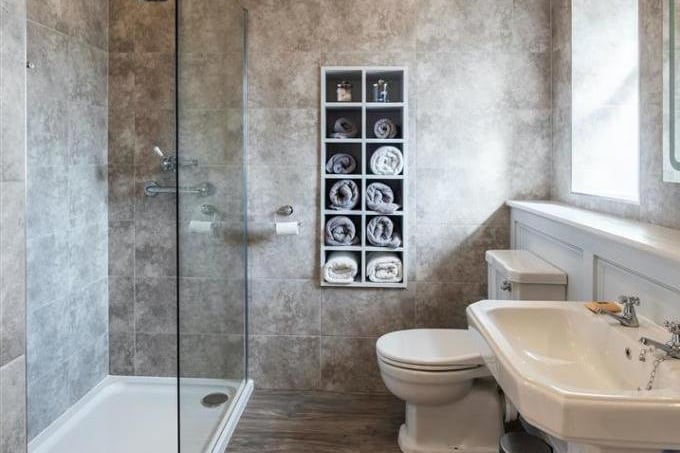 The bathroom has been recently redone by the current owners and has a modern suite with a large walk in shower and heated towel rail.