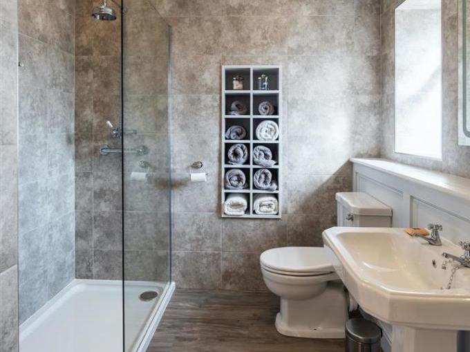 The bathroom has been recently redone by the current owners and has a modern suite with a large walk in shower and heated towel rail.