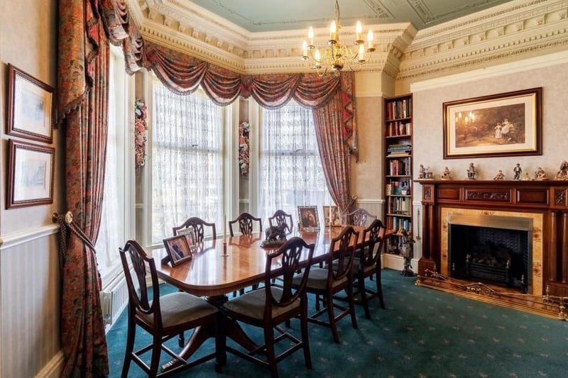 The dining room is also a large and elegant room. It has a large bay window which floods the room with light, feature oak fireplace with decorative insert and inset living flame basket fire. It has fitted shelving to each side of the fire, perfect for book lovers.