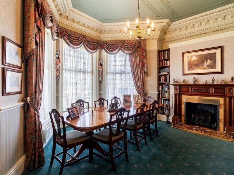 The dining room is also a large and elegant room. It has a large bay window which floods the room with light, feature oak fireplace with decorative insert and inset living flame basket fire. It has fitted shelving to each side of the fire, perfect for book lovers.