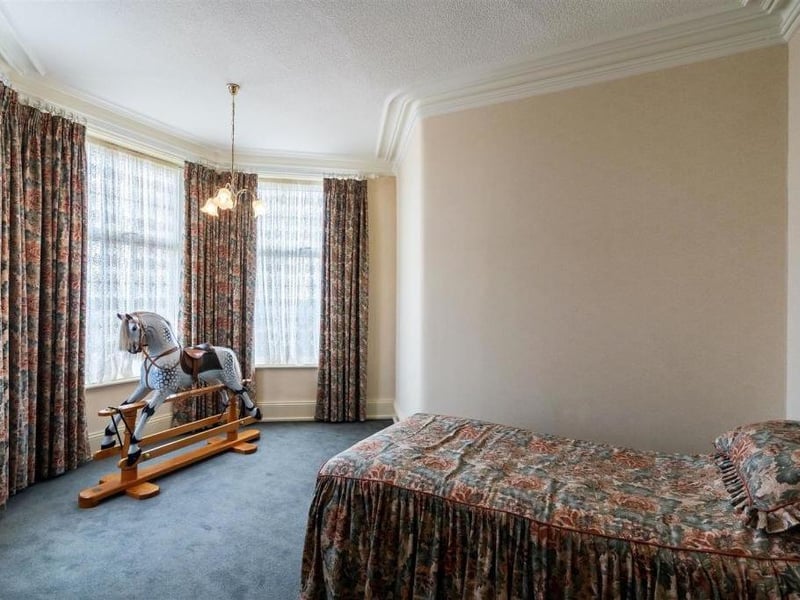 The front bedroom offers long range views over Pudsey.