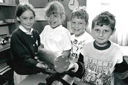 Newton Hill J & I School. Pupils with a time capsule.