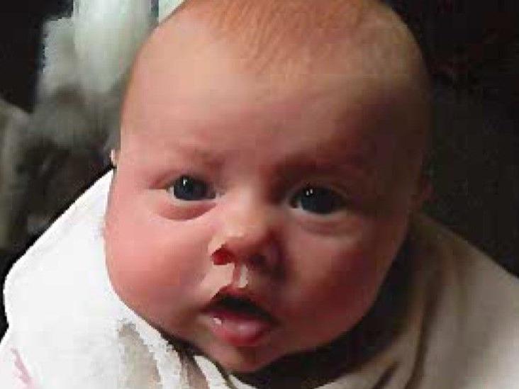 Two-month-old Daisy Mae died three days after 31-year-old dad John Burrill  threw her onto the sofa in a fit of temper,  fracturing her skull
The Fleetwood tot's  injuries were consistent with being gripped by the legs and swung against a hard surface.
Mr Justice James Goss ordered Burrill to serve a minimum of 18 years in jail.