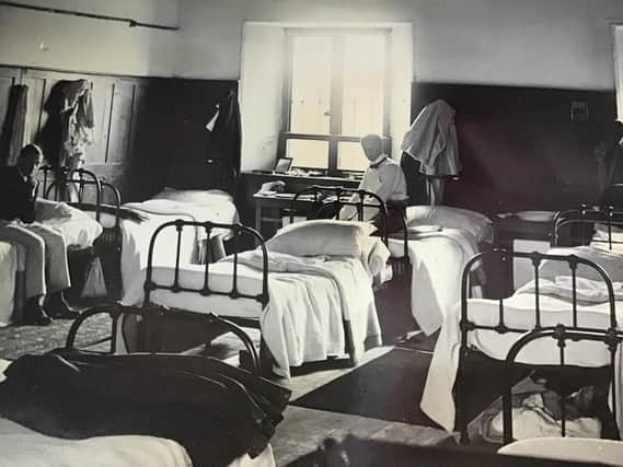 Students relax in one of the dormatories at Rossall School 1890s