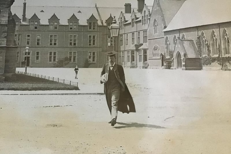 A teacher strolls across the grounds - the scene has hardly changed, it is still so recognisable today