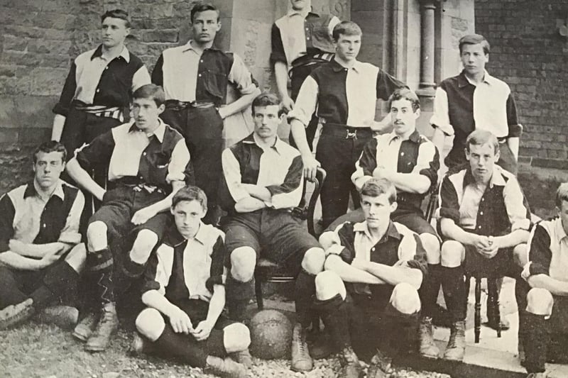 The school football team pose for a picture. Had they won a tournament, perhaps?