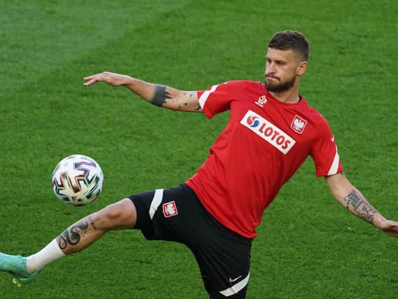 LIMBERING UP: Leeds United's Polish international midfielder Mateusz Klich in a training session at the Arena Gdansk at Poland's base camp on the eve of the start of the Euros. Photo by JANEK SKARZYNSKI/AFP via Getty Images.