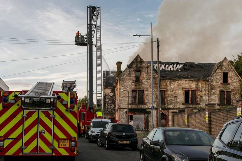 Firefighters battle to bring the blaze under control. Picture by Mick Warn