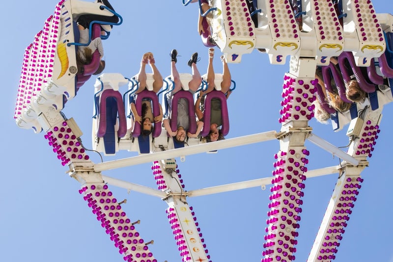 Some visitors enjoying being swept upside down on one of the rides.