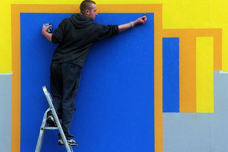 Leeds College of Art and Design student Chris Penfold paints a mural on a Georgian building under redevelopment on North Street.