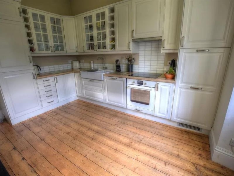 White units and integrated appliances within the house kitchen
