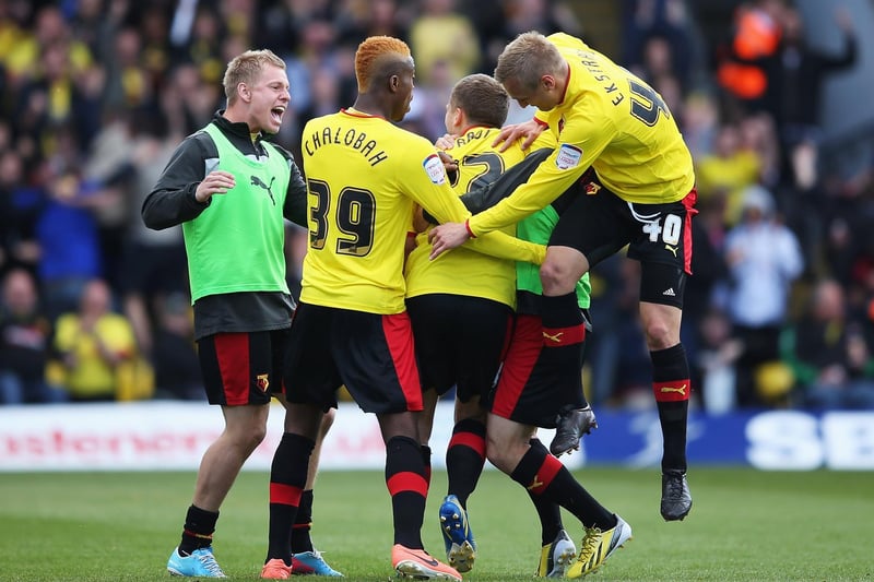 Watford's Almen Abdi is mobbed by team mates after equalising.