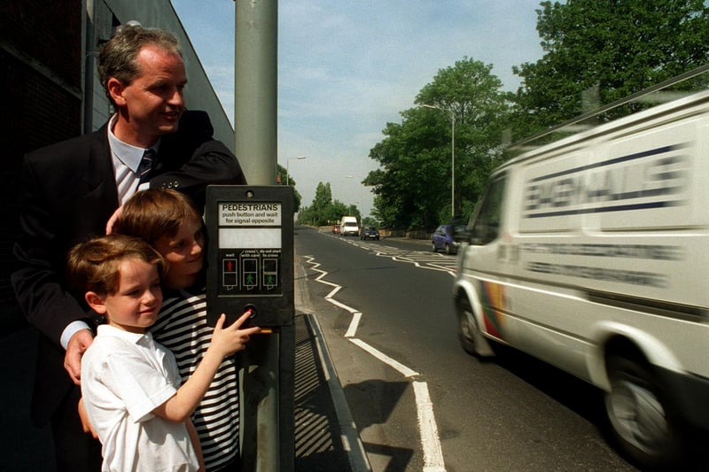 The official opening of a new Pelican crossing on Stanningley Road in August 1996. Coun Eamonn McGee tests the new crossing with his children, Daniel (left) and David.