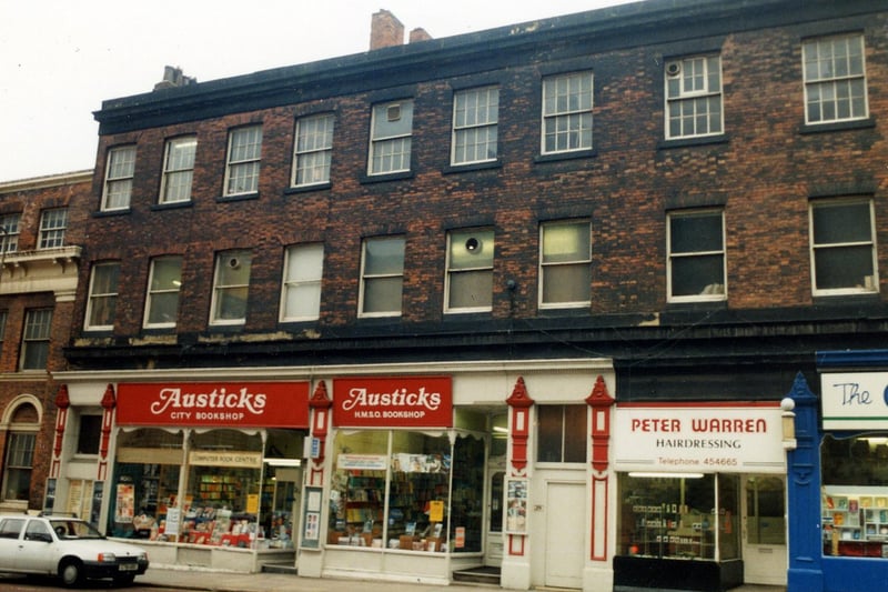 A parade of shops on Cookridge Street in April 1990. On the left is Austicks bookshop then Peter Warren hairdressers. On the far right is The Carmel religious bookshop.