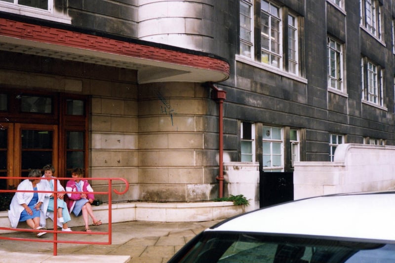 The Calverley Street entrance to Leeds General Infirmary pictured in November 1990. Three members of the nursing staff sit outside.