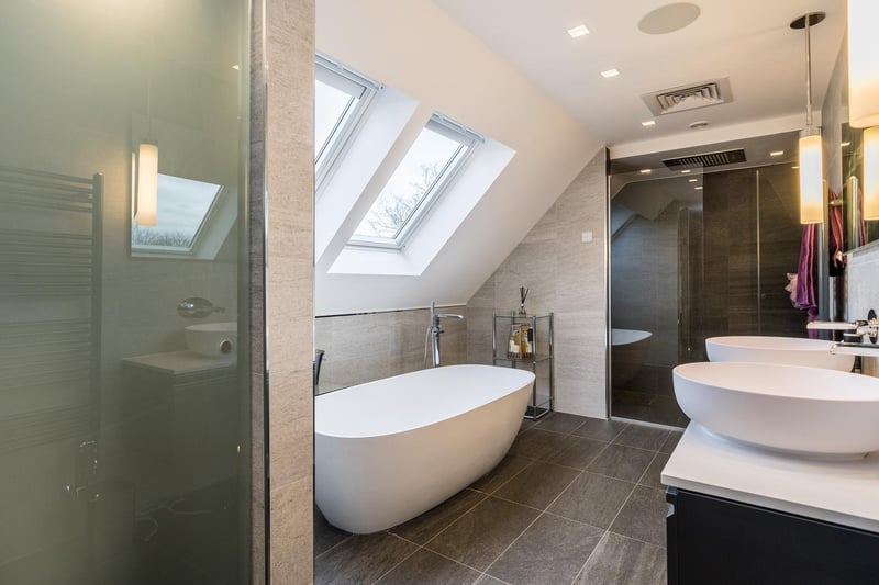 One of the bathrooms with a luxury suite and sound system