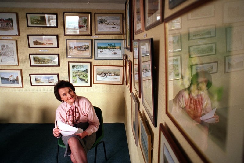 Member Sheila Whitehead looks at some of the exhibits at the Horsforth Arts Society's 40th anniversary exhibition in April 1999.