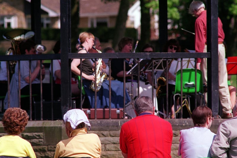 A cool music on a hot day in May 1999 as the Leeds City Concert Band entertains visitors to Hall Park.