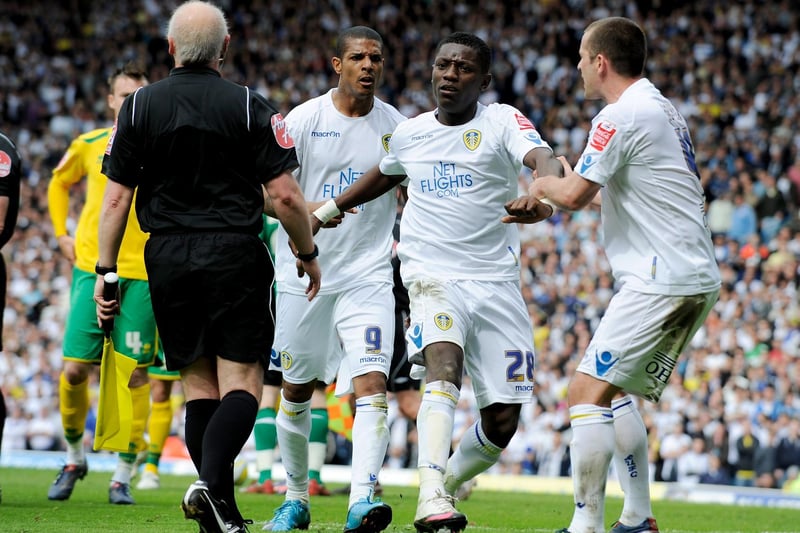 Michael Doyle and Jermaine Beckford try to pull team mate Max Gradel off the pitch as he protests at being sent off.