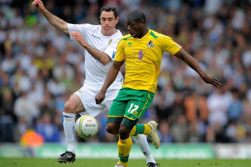 Jo Osei-Kuffour is challenged by Andy Hughes.