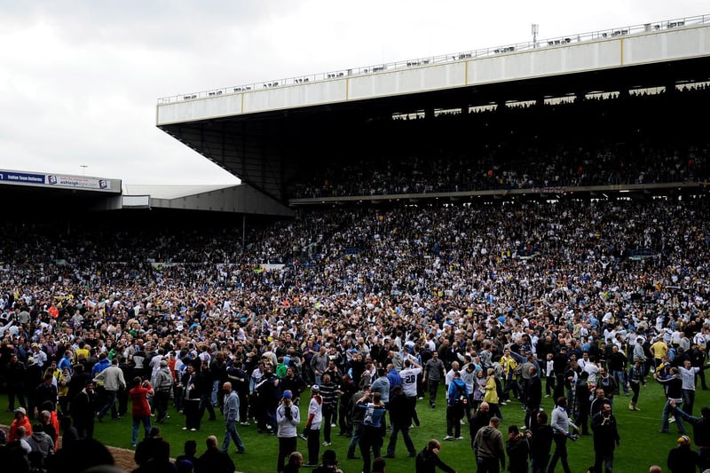 The Elland Road faithful invade the pitch after winning promotion.