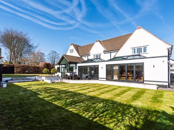 Stretch of lawn within the gardens of the impressive Scalby home