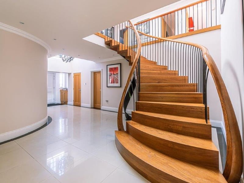 The entrance hallway with its stunning staircase to the first floor