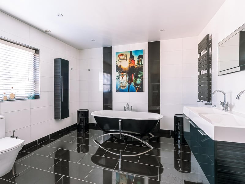 Monochrome style for this bathroom with free standing bath