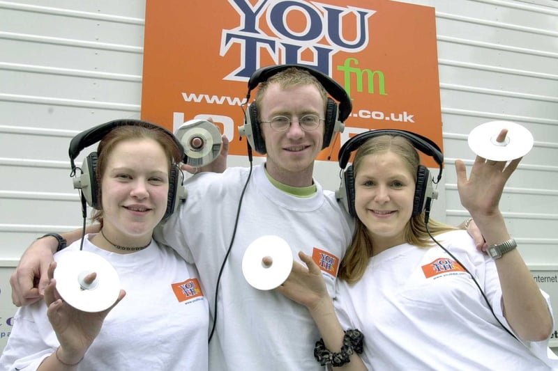 Youth FM hit the airwaves from a mobile studio outside Leeds City Art Gallery. Pictured is DJ Toby One with production assistants Amy Wilson 17 (left) and Ruth Gardner.