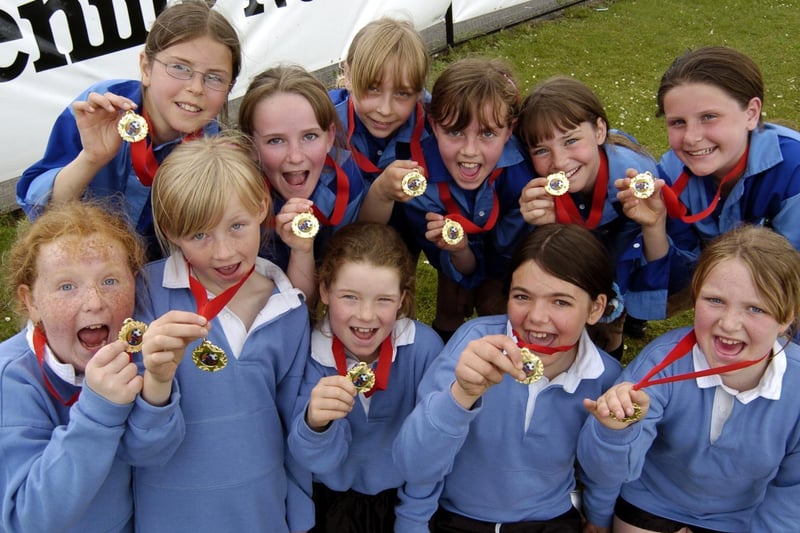 Players from the Scarborough Primary Schools Euro 2004 event show off their medals.