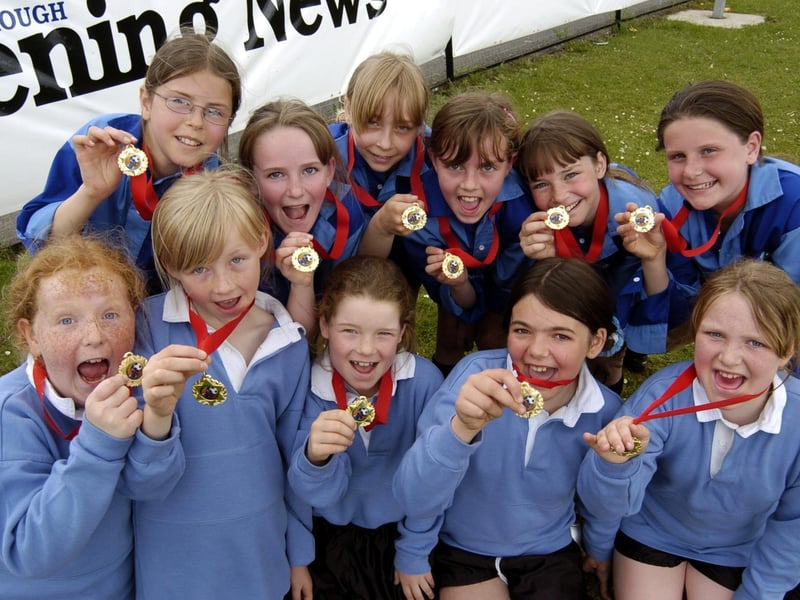 Players from the Scarborough Primary Schools Euro 2004 event show off their medals.