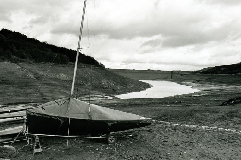 A small sailing dinghy is left high and dry at Scammonden Dam during a 1995 drought.