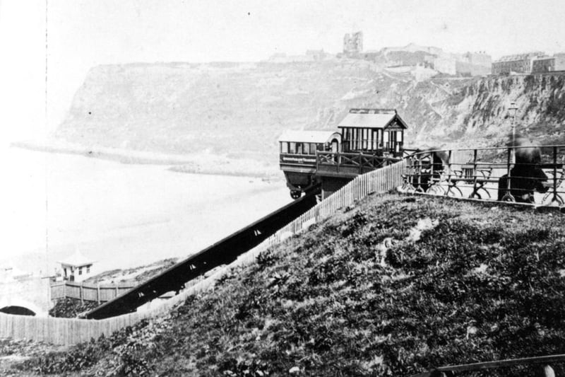 A view from the top of Queen's Parade of the tramway which ran down the cliff side to the pier. The tramway opened on  August 8 1878. However, a runaway carriage damaged the lower station and closed the funicular until the next year. After that a series of accidents and landslips led to its final closure in 1887.