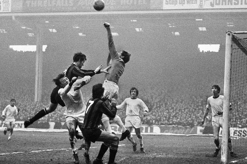 1971 - Wigan Athletic goalkeeper, Dennis Reeves, punches clear under pressure from Tommy Booth and Mike Summerbee of Manchester City with Latic's Billy Sutherland in the mix watched by Ian Gillibrand and Doug Coutts during the FA Cup 3rd round match at Maine Road on Saturday 2nd of January 1971.
Non league Wigan were unlucky to lose against high flying 1st Division side Manchester City to a Colin Bell goal in the 1-0 result.