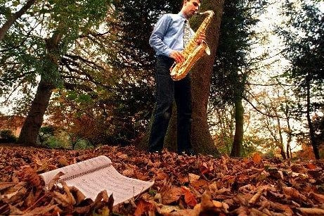 Peter Nichols co-director of the "Sax Spectacular" gets in a little practice at Thornes Park , Wakefield where the 1996 British Sax Congress was set to take place.